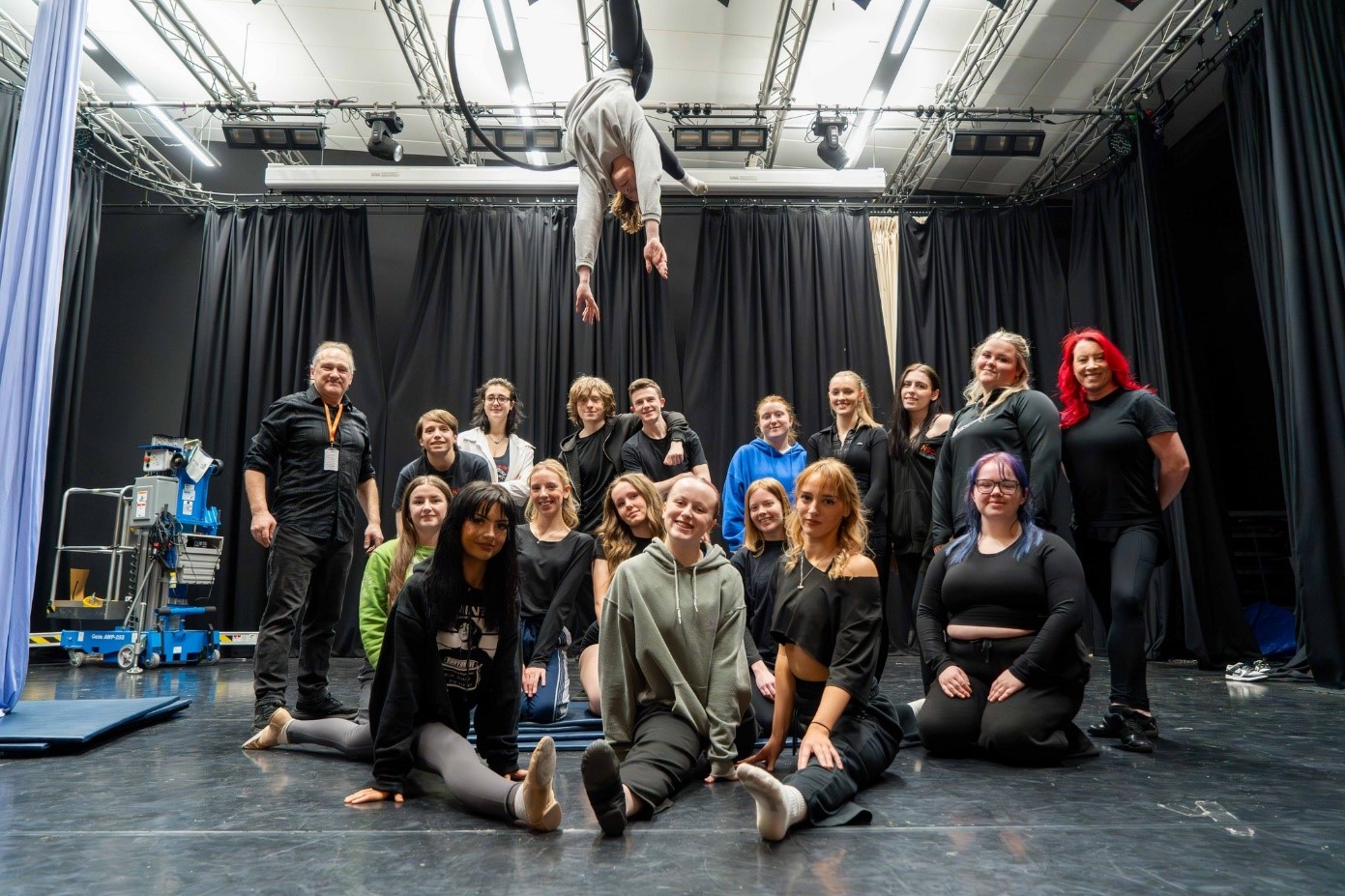 ANdrew Van Buren and Allyson Ford teaching circus skills to College students